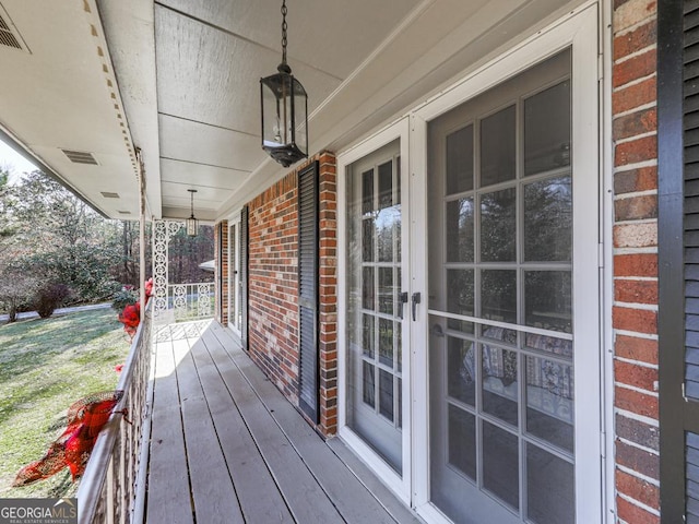 wooden deck featuring a porch