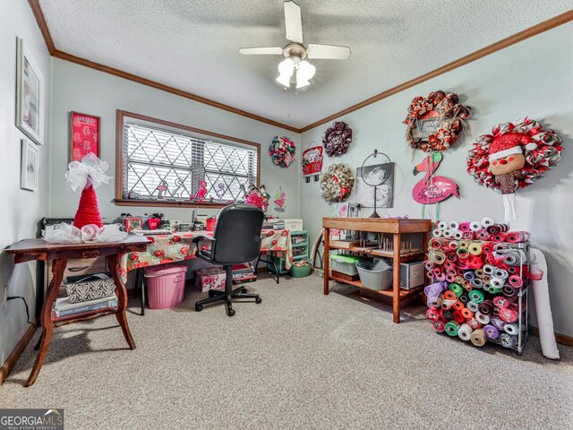 office space featuring a textured ceiling, carpet floors, ceiling fan, and ornamental molding