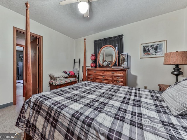 bedroom featuring ceiling fan and a textured ceiling