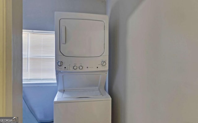 laundry room featuring stacked washer and dryer