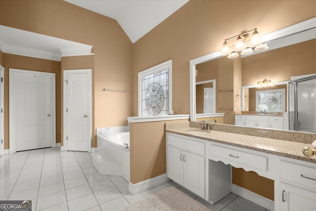 bathroom featuring a tub to relax in, tile patterned flooring, vanity, and vaulted ceiling