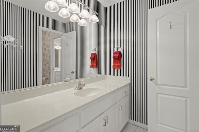 bathroom featuring tile patterned flooring and vanity