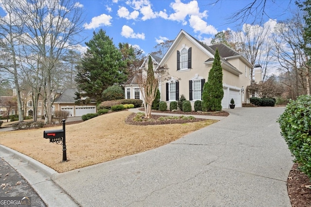 front of property with a garage