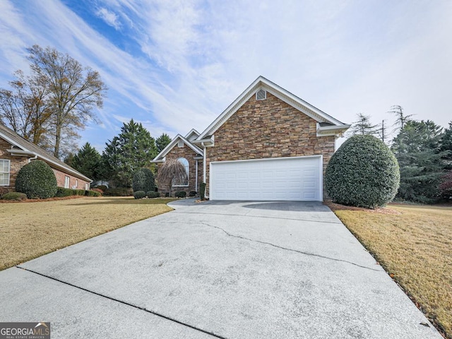 front of property with a garage and a front lawn