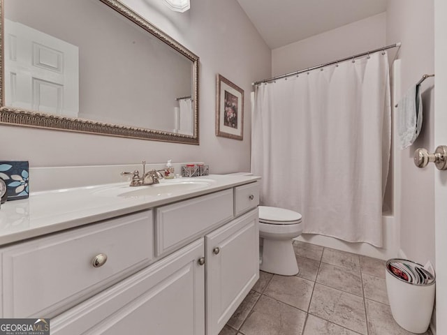 full bathroom with vanity, toilet, and shower / tub combo with curtain