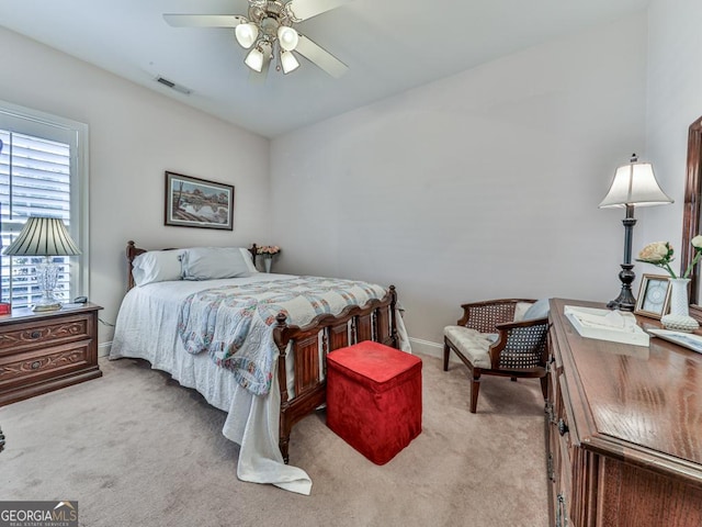 bedroom with light colored carpet and ceiling fan