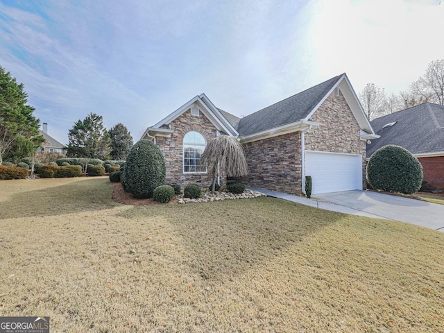 front of property featuring a front yard and a garage