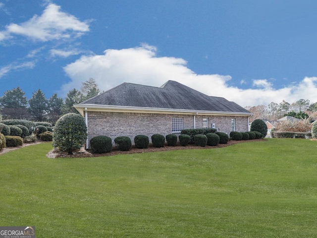 view of property exterior with a lawn