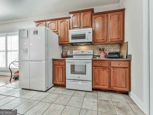 kitchen featuring light tile patterned flooring, white appliances, ornamental molding, and tasteful backsplash