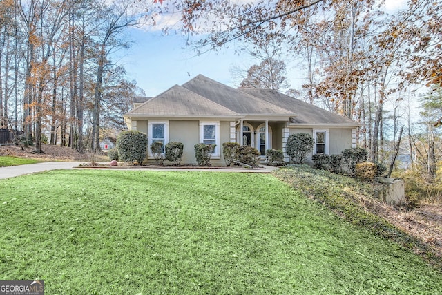 ranch-style house with a front lawn