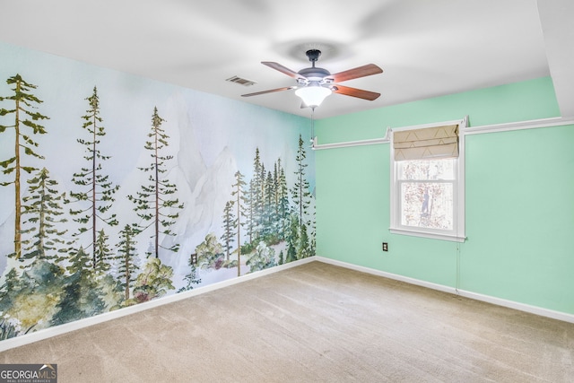 empty room with carpet flooring and ceiling fan