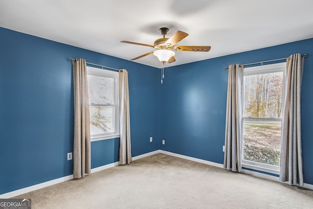 empty room featuring carpet and plenty of natural light