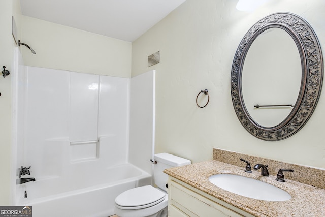 full bathroom featuring washtub / shower combination, vanity, and toilet