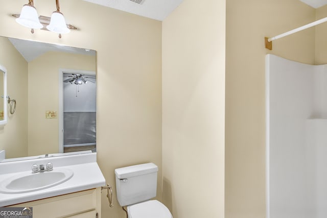 bathroom featuring walk in shower, a textured ceiling, vanity, ceiling fan, and toilet