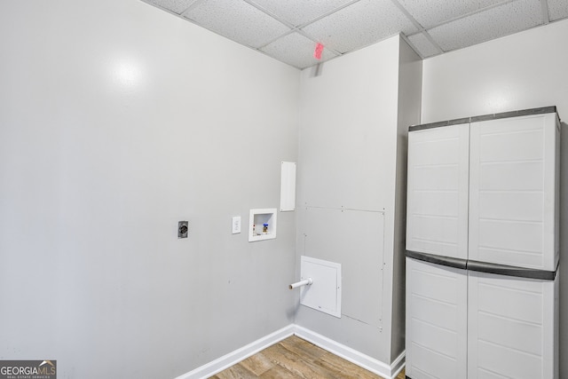 laundry room featuring hookup for an electric dryer, hardwood / wood-style floors, and washer hookup