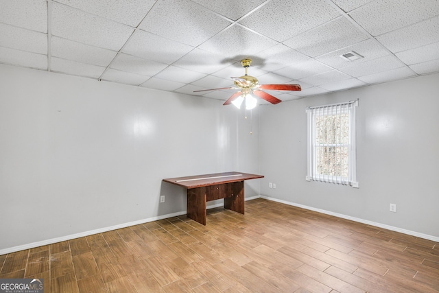 game room with a paneled ceiling, ceiling fan, and wood-type flooring