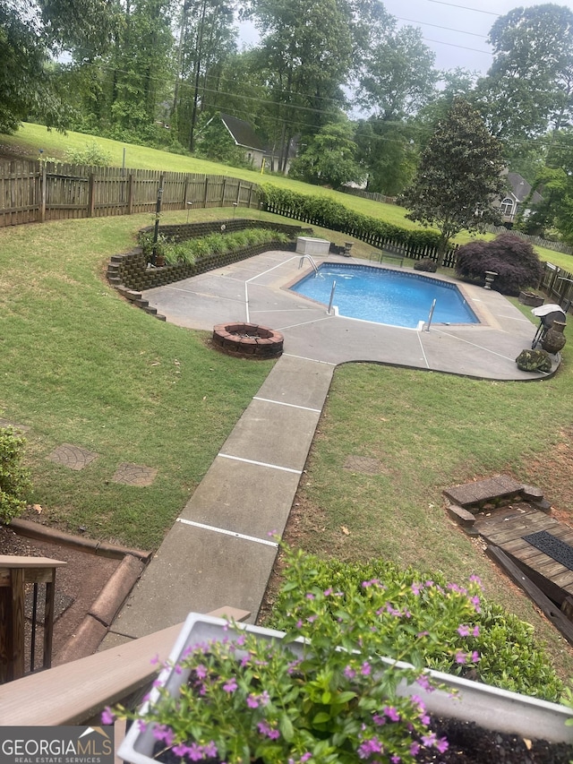 view of pool featuring a yard and a patio area