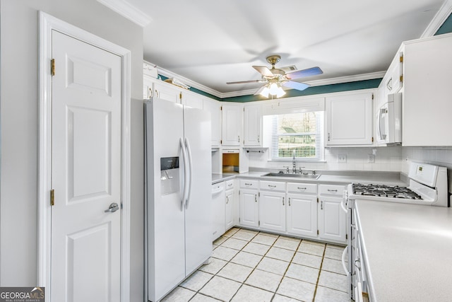 kitchen with white cabinetry, sink, backsplash, crown molding, and white appliances