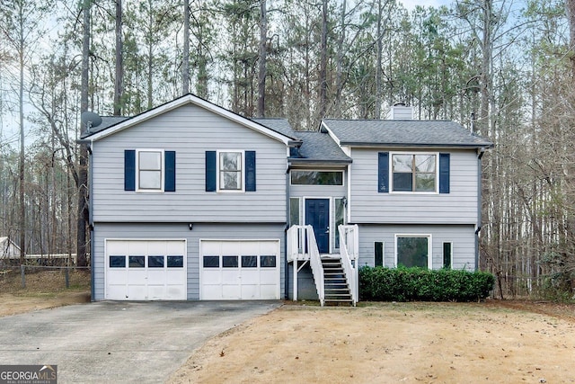 split foyer home featuring a garage