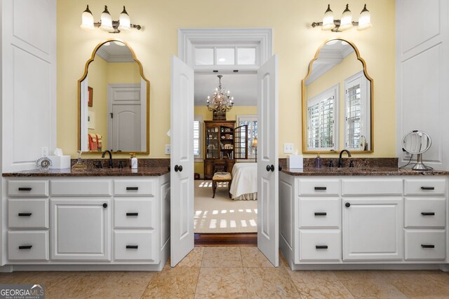 bathroom featuring a chandelier, vanity, and hardwood / wood-style flooring