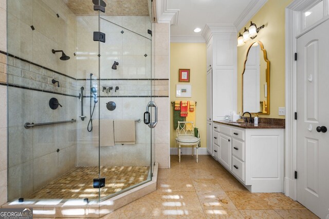 bathroom featuring crown molding, tile patterned flooring, vanity, and walk in shower