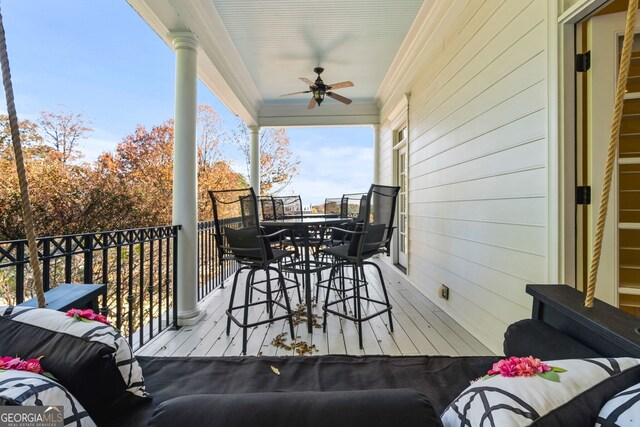 wooden terrace with ceiling fan