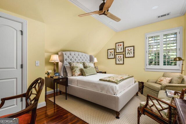 bedroom featuring ceiling fan, dark hardwood / wood-style flooring, vaulted ceiling, and ornamental molding