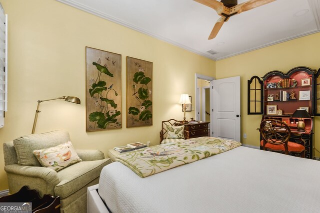 bedroom with ceiling fan and ornamental molding