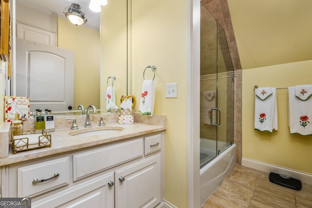 bathroom featuring vanity and enclosed tub / shower combo