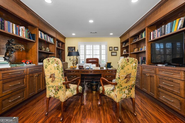 home office with dark hardwood / wood-style flooring and ornamental molding