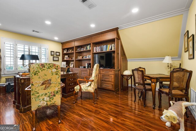 living area with dark hardwood / wood-style floors and crown molding