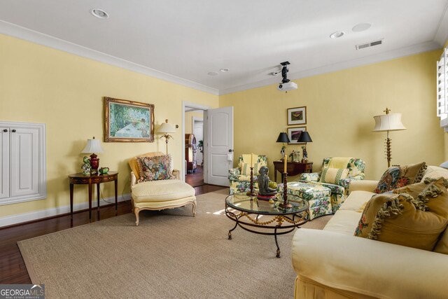 living room featuring crown molding and hardwood / wood-style floors