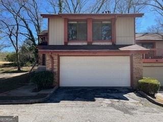 1153 Village Main St, Stone Mountain, GA 30088 - view of front of home featuring a garage and driveway