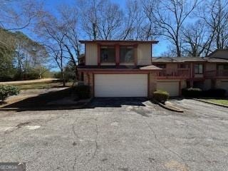1153 Village Main St, Stone Mountain, GA 30088 - view of front of house with a garage and aphalt driveway