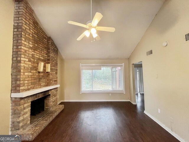 unfurnished living room with dark wood-type flooring, high vaulted ceiling, ceiling fan, a fireplace, and beamed ceiling