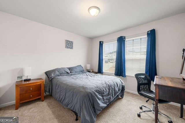 bedroom featuring light carpet