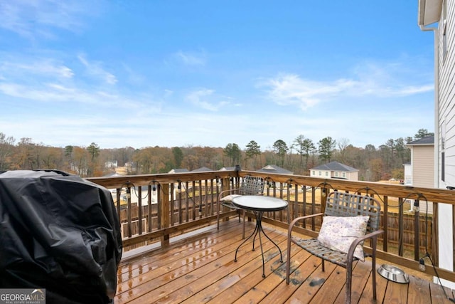 wooden terrace featuring grilling area