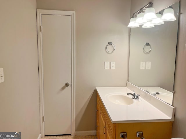 bathroom with tile patterned floors and vanity