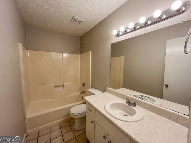 full bathroom with tile patterned floors, vanity, a textured ceiling, shower / tub combination, and toilet