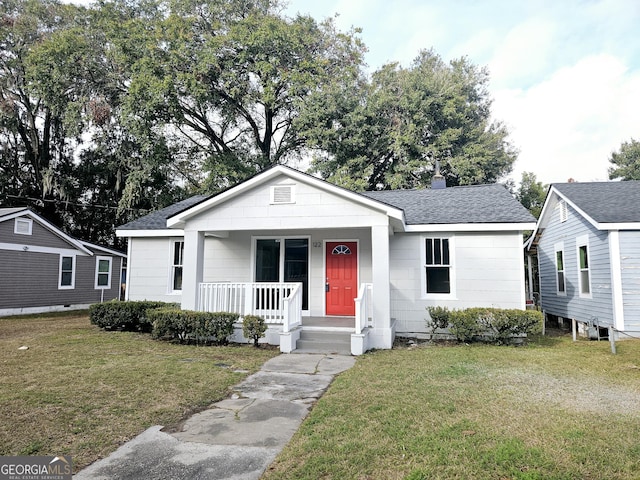 view of front of property with a porch and a front yard