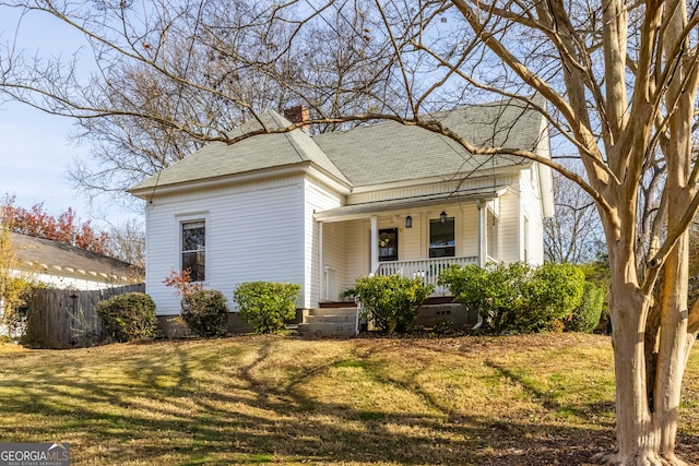 view of front of property with a front yard and a porch