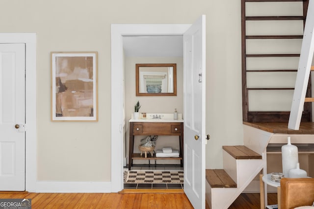 hallway featuring wood-type flooring