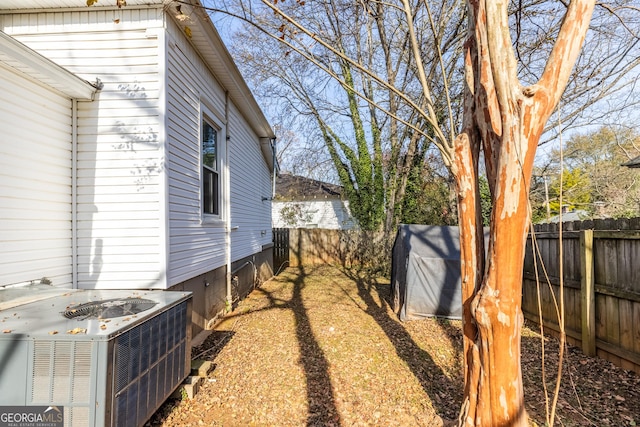 view of yard with central AC