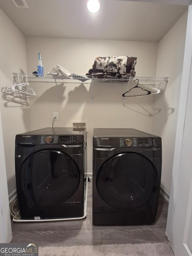 laundry room featuring separate washer and dryer