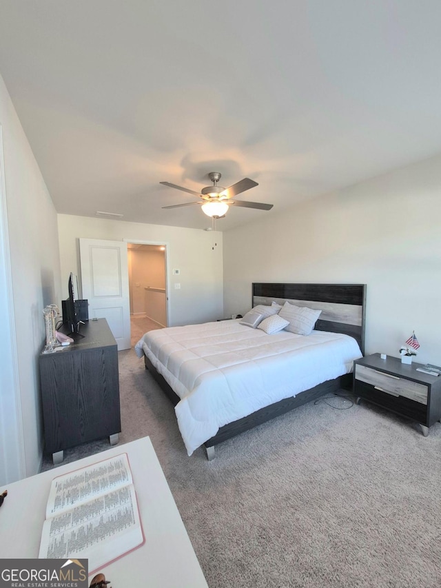 bedroom with dark colored carpet and ceiling fan