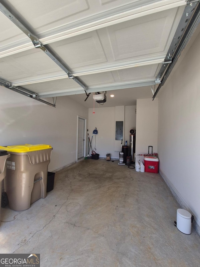 garage with electric panel and a garage door opener