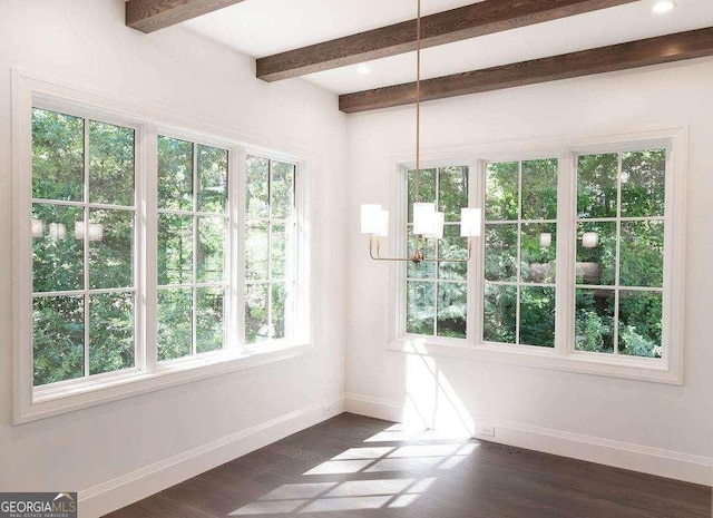 interior space featuring beamed ceiling and dark hardwood / wood-style floors