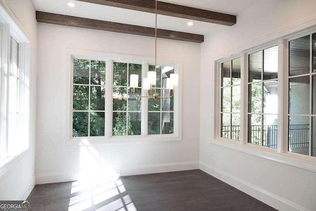 unfurnished sunroom with beamed ceiling, plenty of natural light, and a chandelier