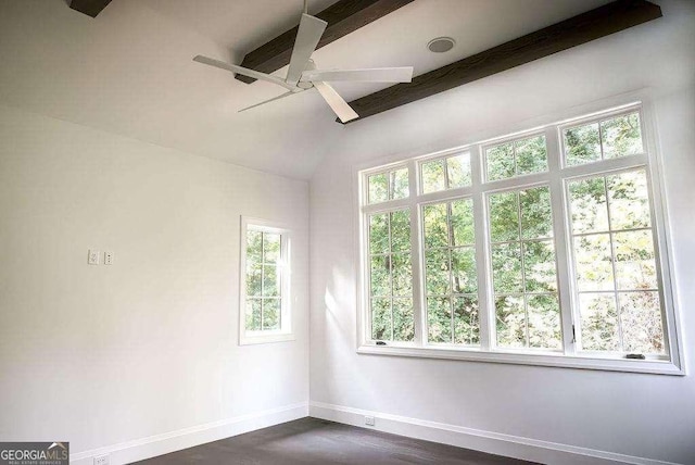 spare room featuring ceiling fan, lofted ceiling with beams, and dark hardwood / wood-style floors