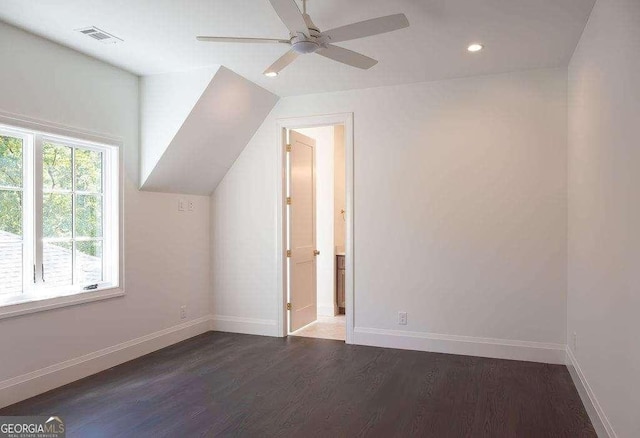 additional living space with vaulted ceiling, ceiling fan, and dark hardwood / wood-style floors